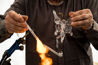 Midsection of man holding hands