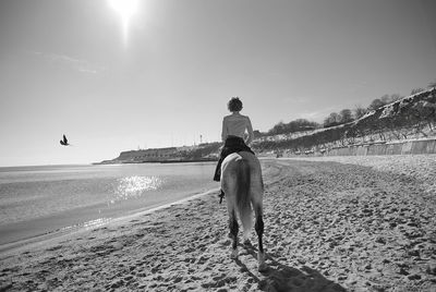 Man on beach against sky