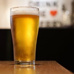 Close-up of beer glass on table