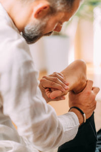 Shiatsu foot massage. therapist massaging woman's foot.