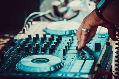 Close-up of person using sound mixer 