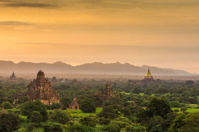 Panoramic view of temple and building against sky