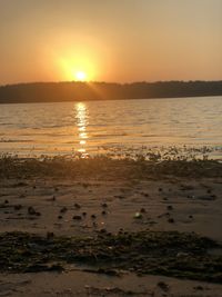 Scenic view of sea against sky during sunset