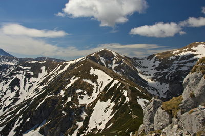 Scenic view of snowcapped mountains against sky