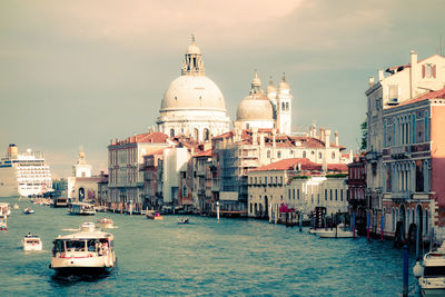 Santa maria della salute by canal against sky