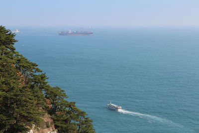 High angle view of boat sailing in sea against sky