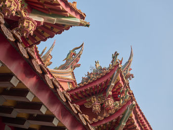 Low angle view of traditional temple building against sky
