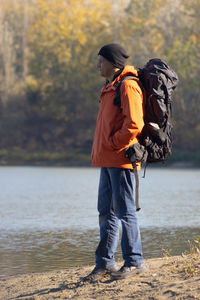 Rear view of man walking on beach