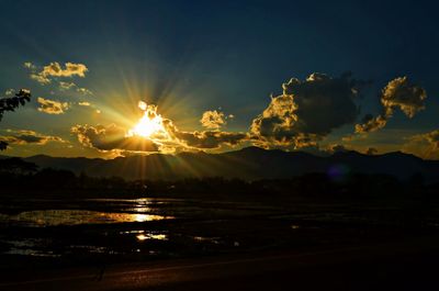 Scenic view of mountains against sky at sunset