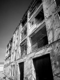 Low angle view of old building against clear sky