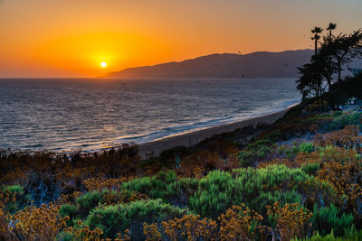 Scenic view of sea against sky during sunset