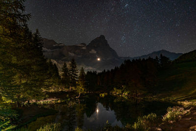 Scenic view of matterhorn against sky at night