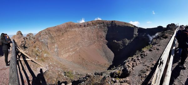 Panoramic view of mountains against clear blue sky