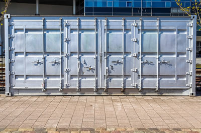 Detailed close up view on metal and steel surfaces on a silver cargo containter