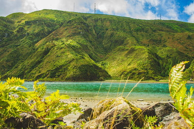 Scenic view of bay against sky