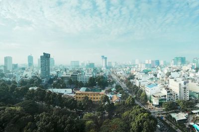 High angle view of buildings in city against sky