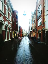 Street amidst buildings against sky