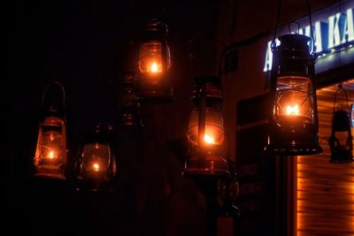 Dangling lanterns shining in the dark street