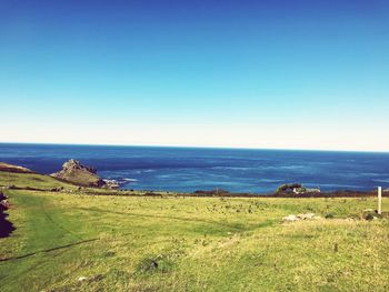 Scenic view of sea against clear blue sky