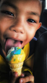 Close-up portrait of woman holding ice cream