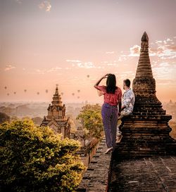 Rear view of woman looking at temple