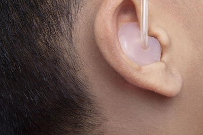 Close-up person wearing hearing aid