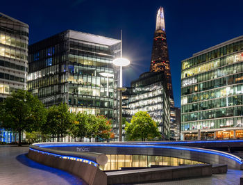 Modern buildings in city at night