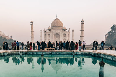 Taj mahal at foggy sunrise in winter
