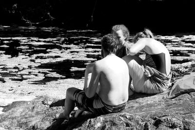 Full length of woman sitting on bench