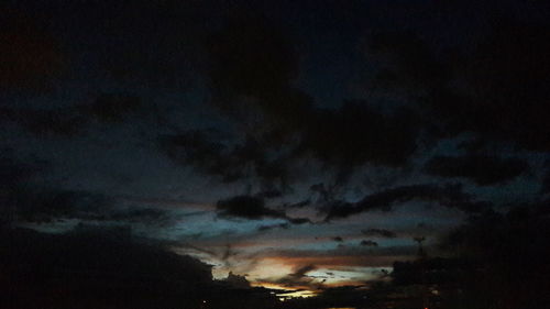 Low angle view of storm clouds at night