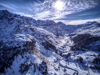 Scenic view of snowcapped mountains against sky