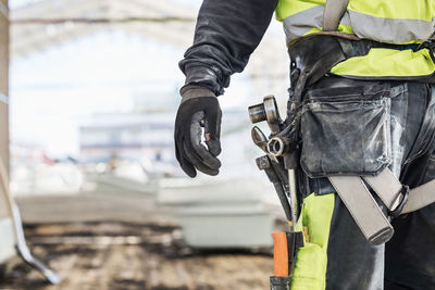 Rear view of man working at construction site