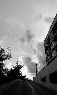 Low angle view of building against cloudy sky