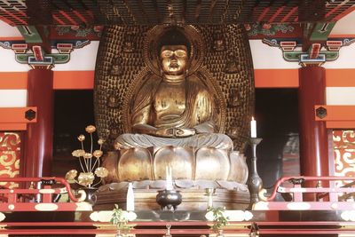 Statue in temple outside building