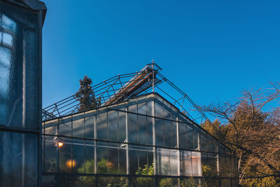 Low angle view of building against clear blue sky