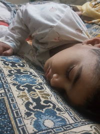 Boy sleeping on bed