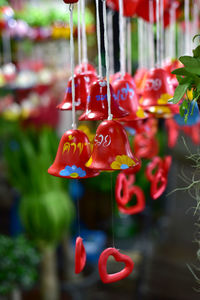 Close-up of multi colored hanging for sale at market stall