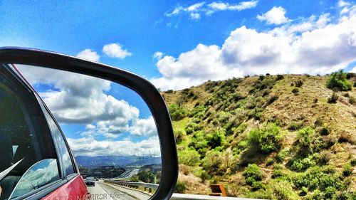 View of road against cloudy sky