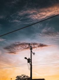 Low angle view of silhouette street light against sky during sunset