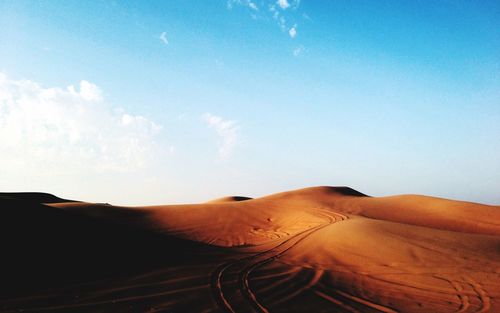 Scenic view of desert against sky