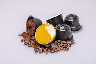 High angle view of coffee beans on white background