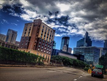 City buildings against cloudy sky