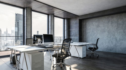 Computers on desks in modern office