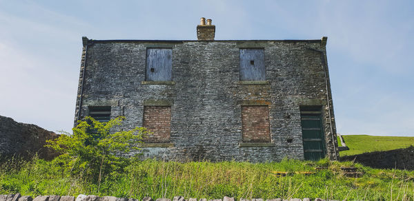 Low angle view of old building against sky