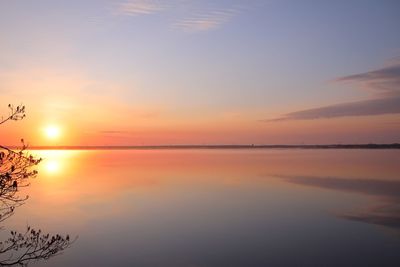 Scenic view of sea against romantic sky at sunset