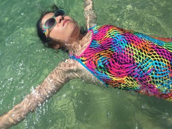 High angle view of woman swimming in pool