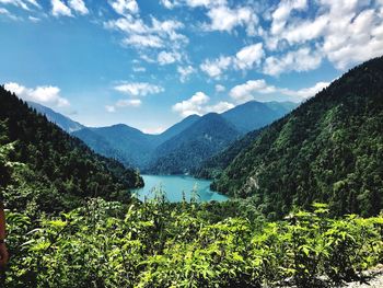 Scenic view of lake and mountains against sky