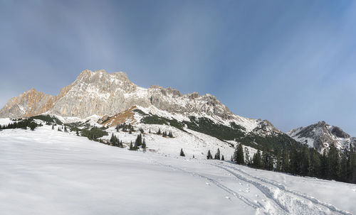 Scenic view of snow covered mountain against sky