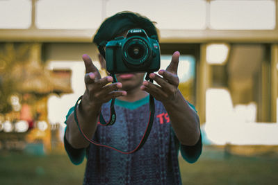 Portrait of man photographing