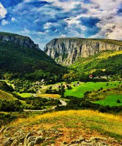 Scenic view of landscape and mountains against sky